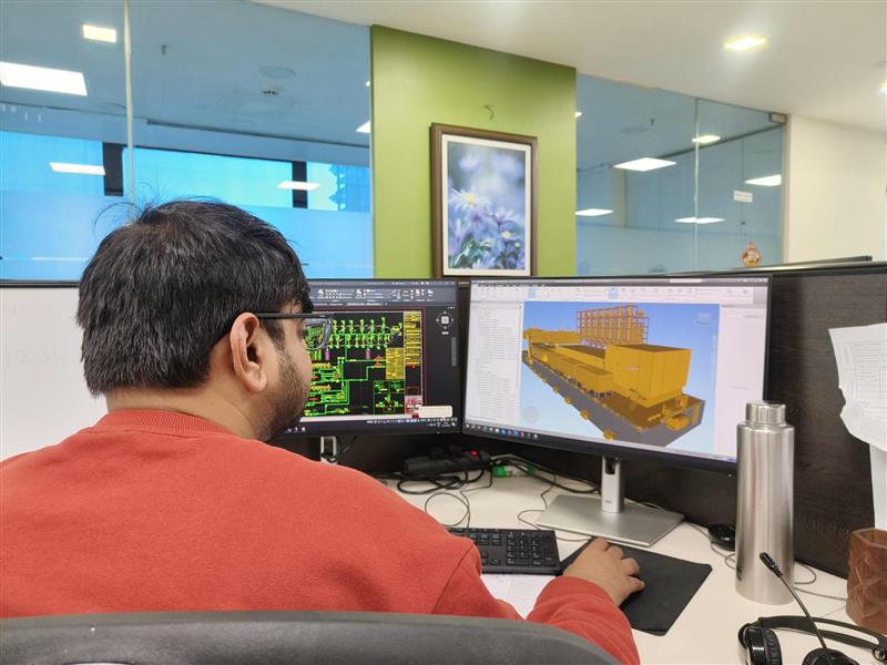 Engineers preparing structural layouts in 3D software